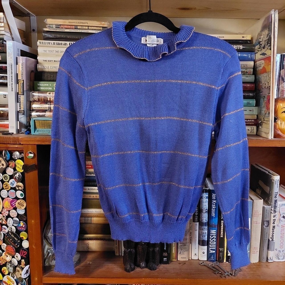 Vintage purple sweater with a ruffle‎ collar and gold stripe detail.